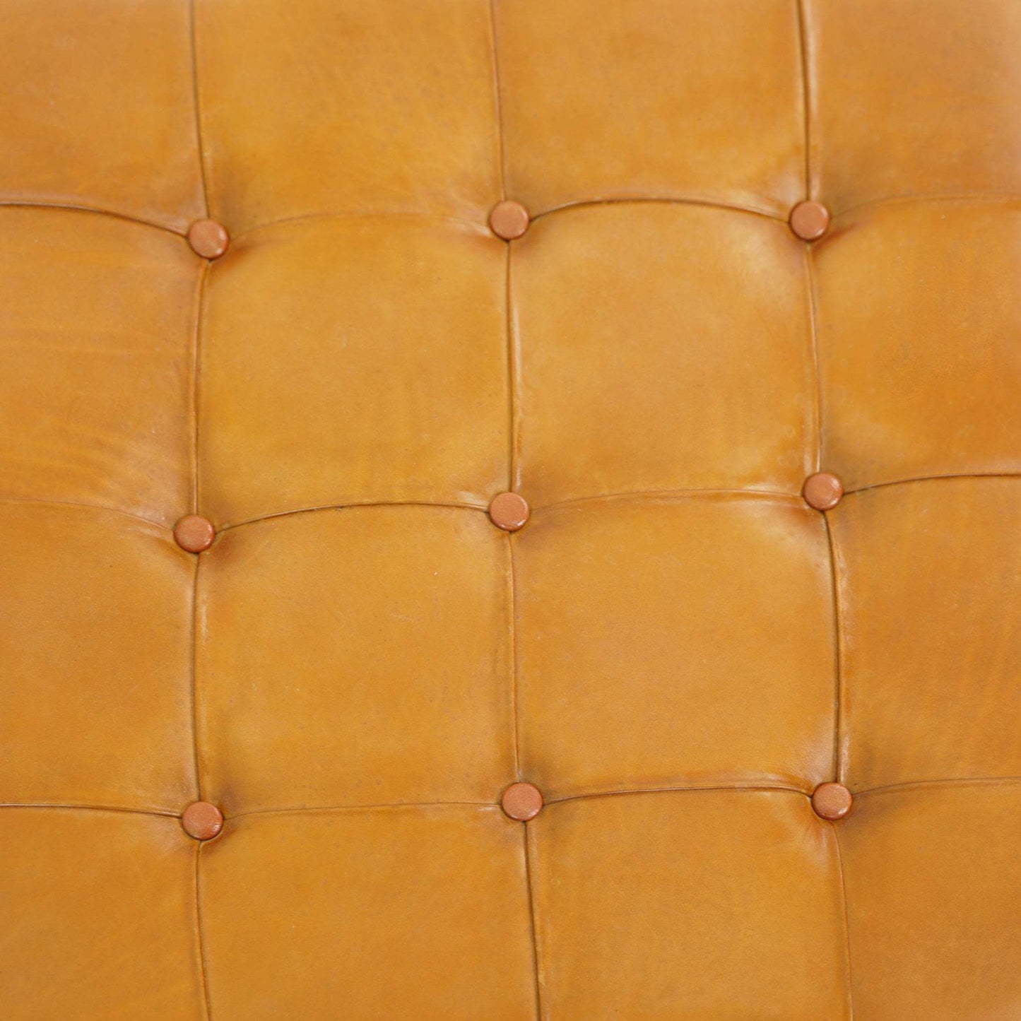 Close-up of tan tufted leather furniture upholstery, FredCo International home decor