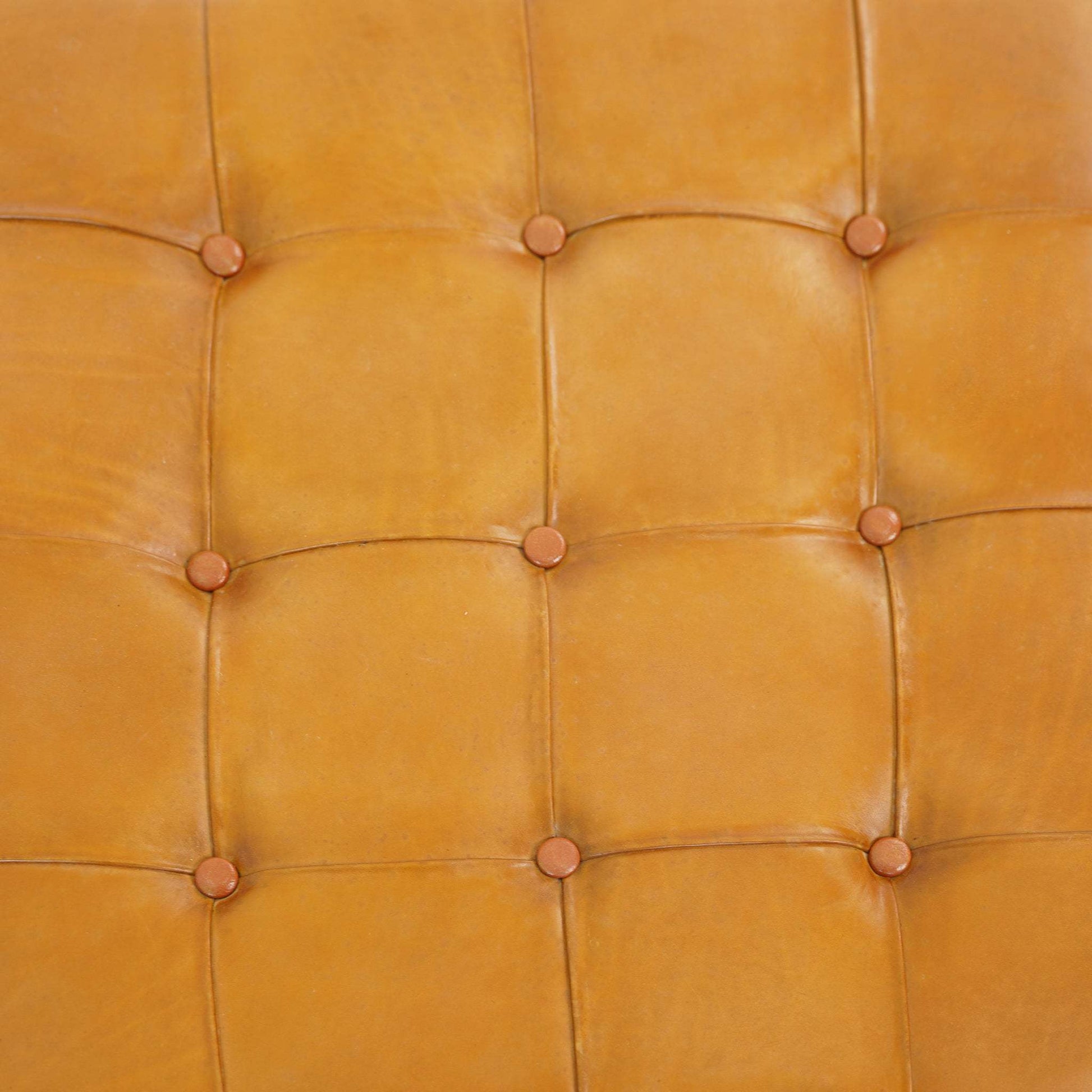 Close-up of tan tufted leather furniture upholstery, FredCo International home decor