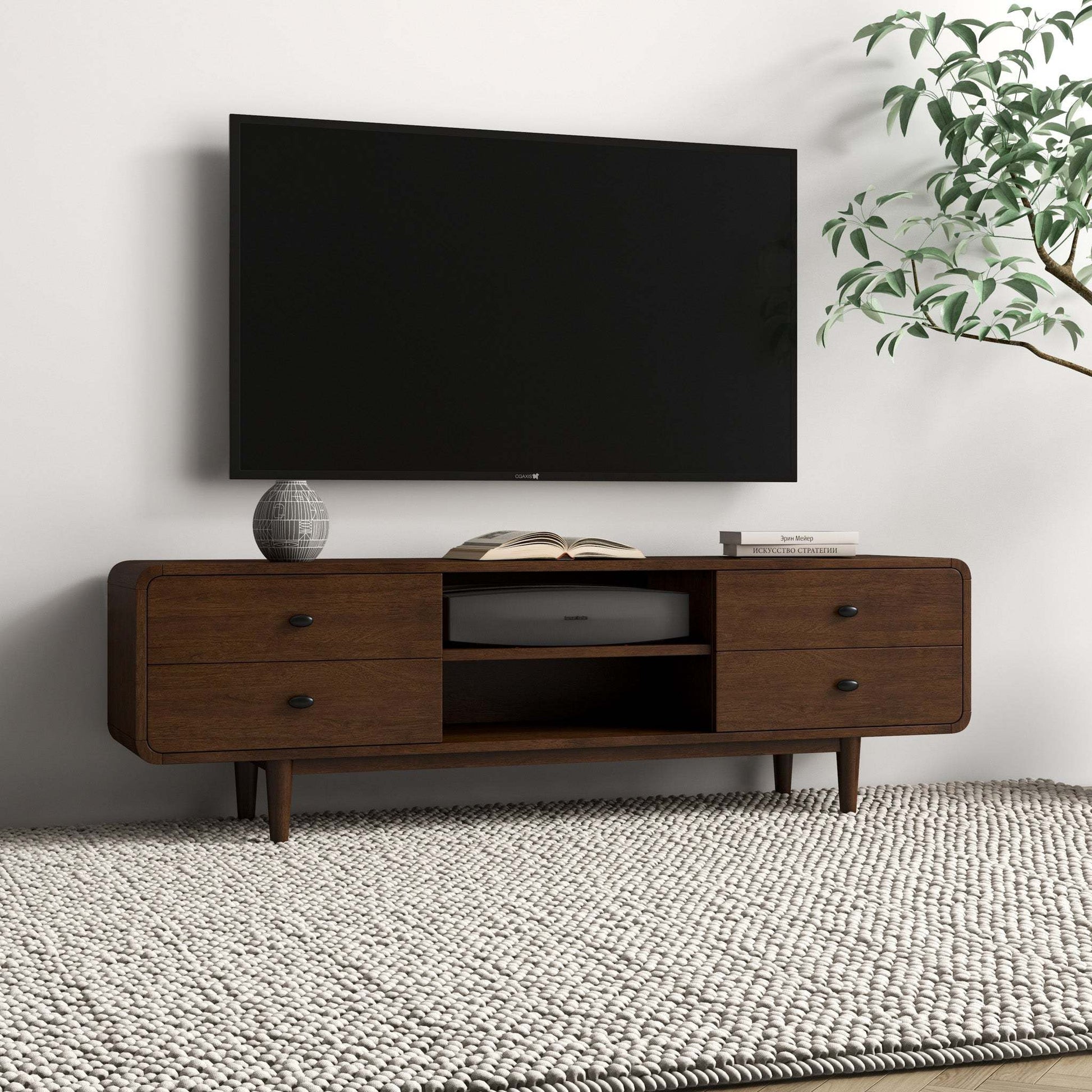 Modern living room with wall-mounted TV, mid-century wood TV stand, and decorative plant