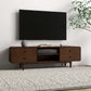 Modern living room with wall-mounted TV, mid-century wood TV stand, and decorative plant