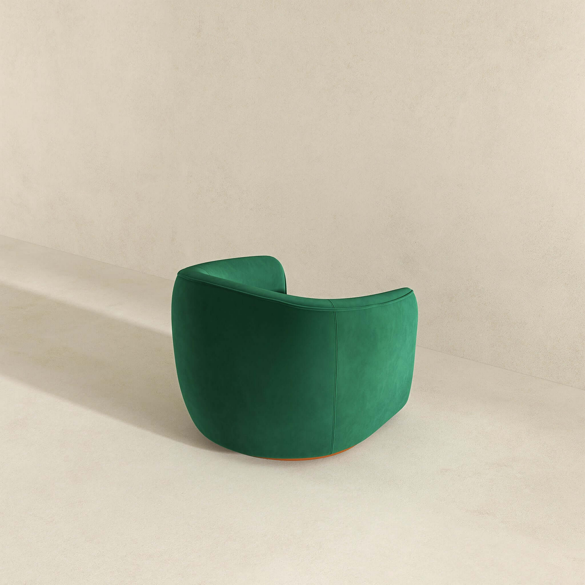 Modern green accent chair with curved back in minimalist room from FredCo International furniture