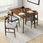 Modern wooden dining table with four grey cushioned chairs in bright home interior