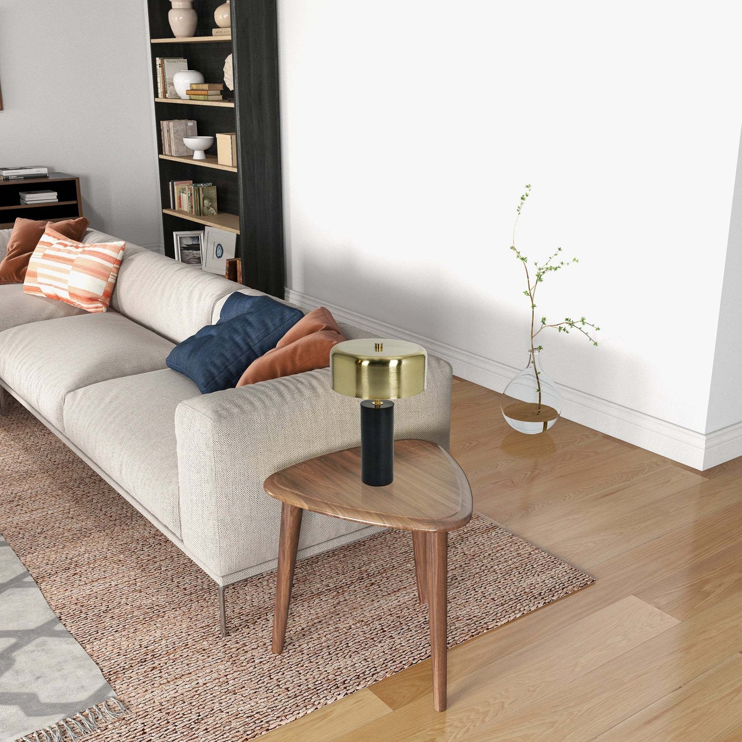 Modern living room with beige sofa, decorative pillows, wood side table and brass table lamp
