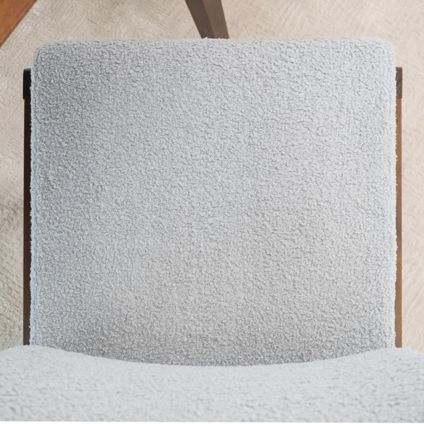 Light gray textured fabric dining chair with wooden frame on beige carpet, FredCo International