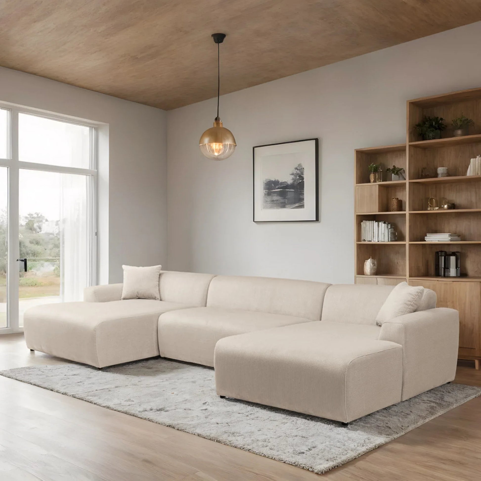 Modern living room with beige sectional sofa, wooden shelves, and large window at FredCo International