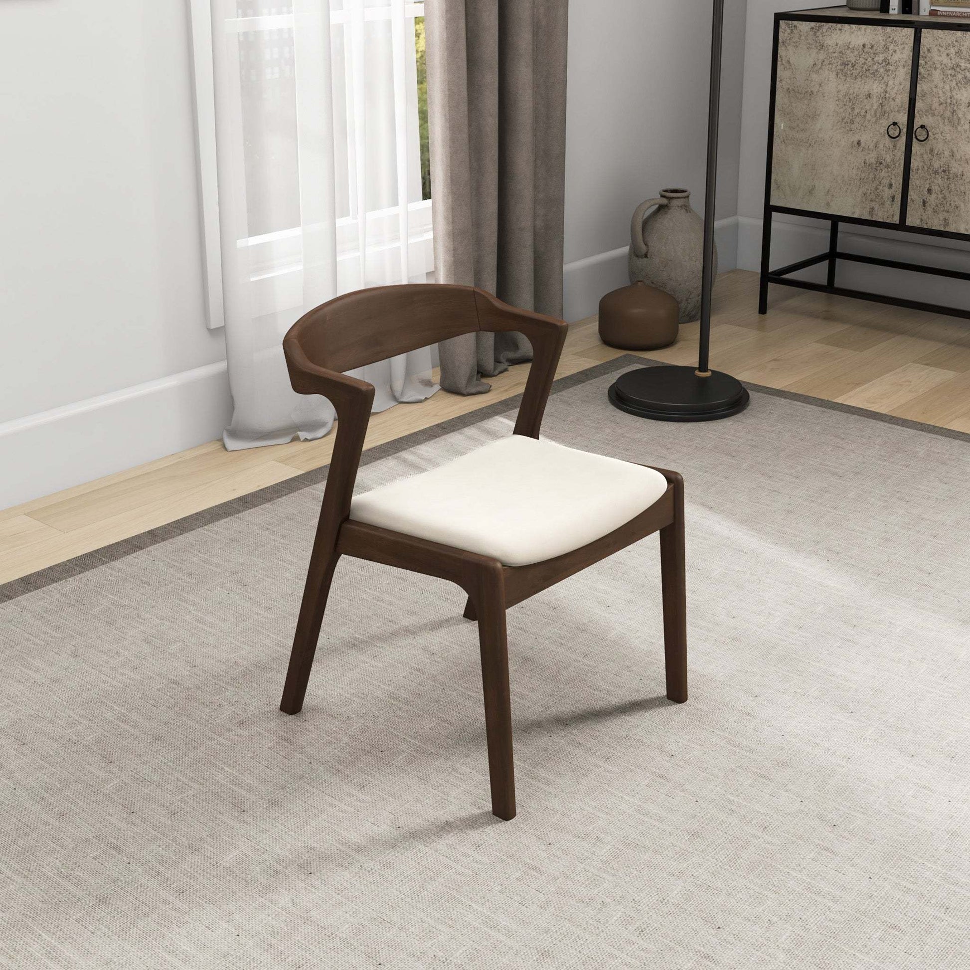 Modern wooden accent chair with white cushion in a stylish living room, FredCo International furniture