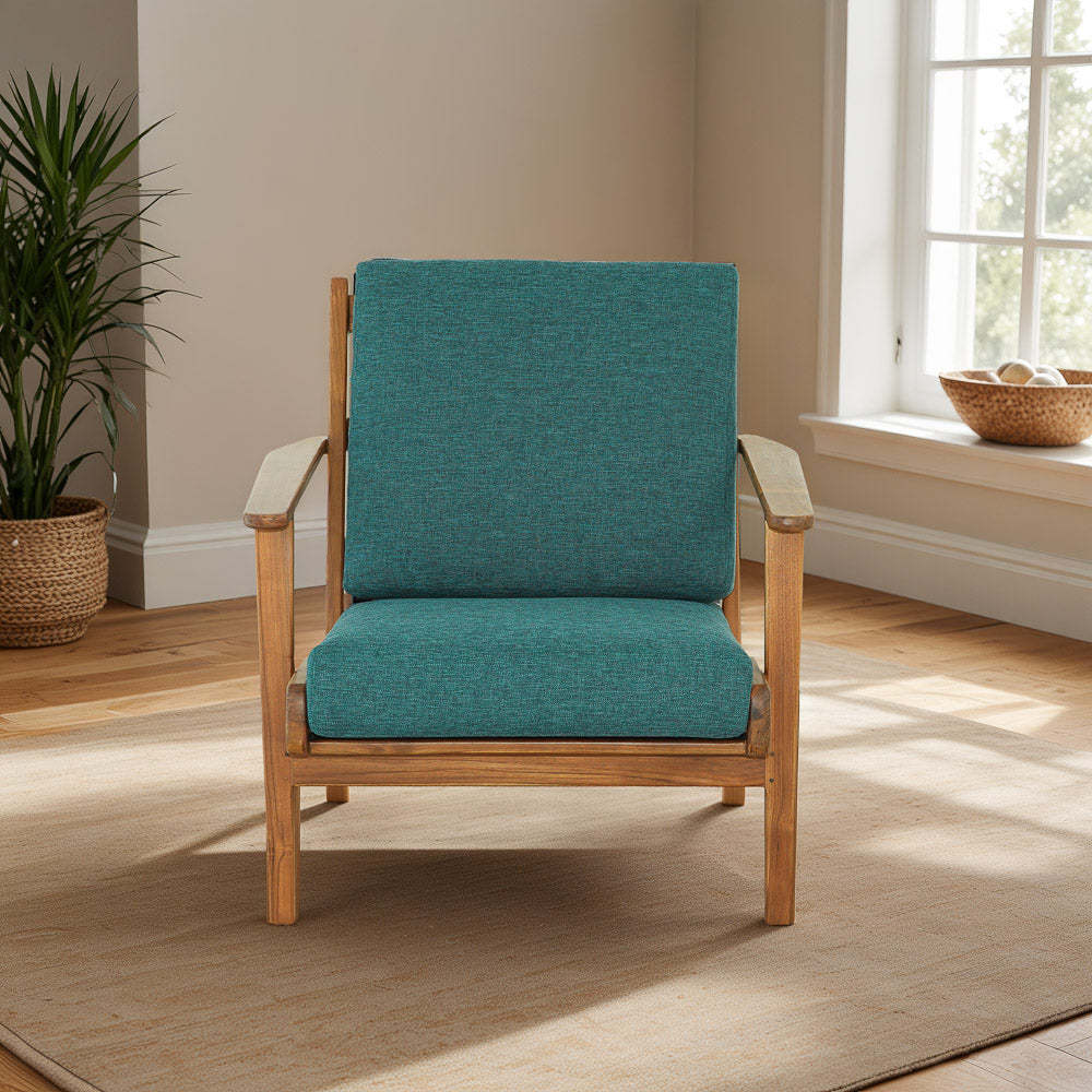 Modern teal upholstered armchair with wooden frame in bright living room, FredCo International furniture