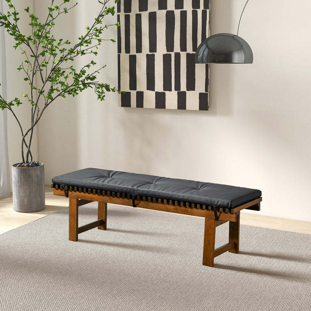 Modern wood bench with black cushion in stylish living room, contemporary home decor furniture
