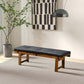 Modern wood bench with black cushion in stylish living room, contemporary home decor furniture