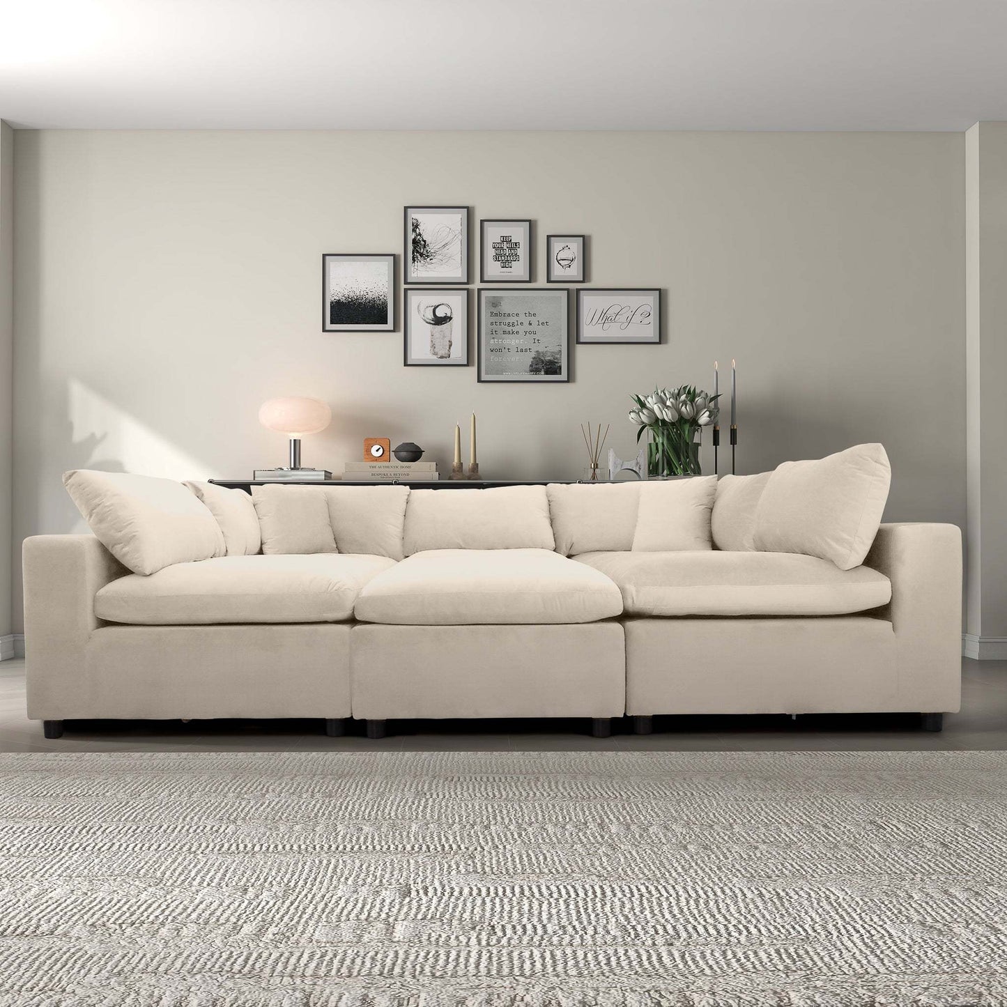 Modern beige sectional sofa in stylish living room with gallery wall, rug, and decor