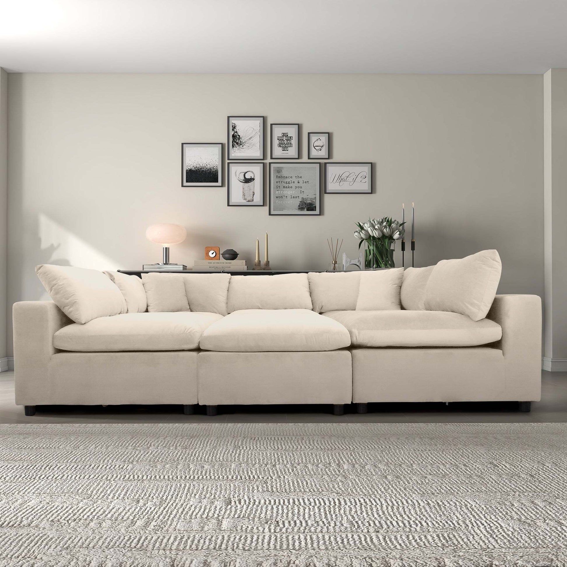 Modern beige sectional sofa in stylish living room with gallery wall, rug, and decor