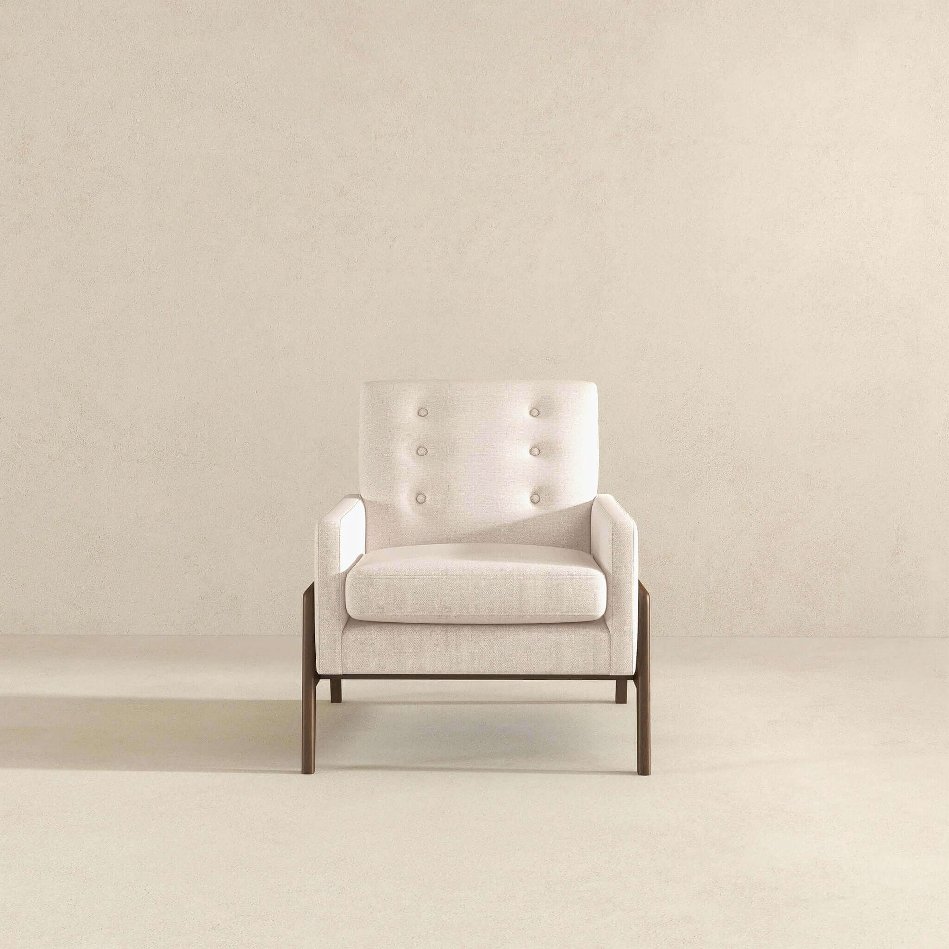 Modern beige accent chair with wood legs in minimalist setting, FredCo International furniture