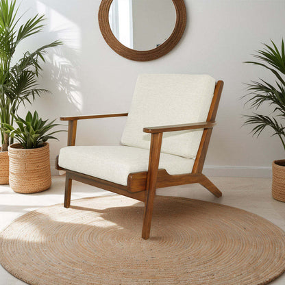 Mid-century modern wooden armchair with cream cushion in bright living room with plants and round rug
