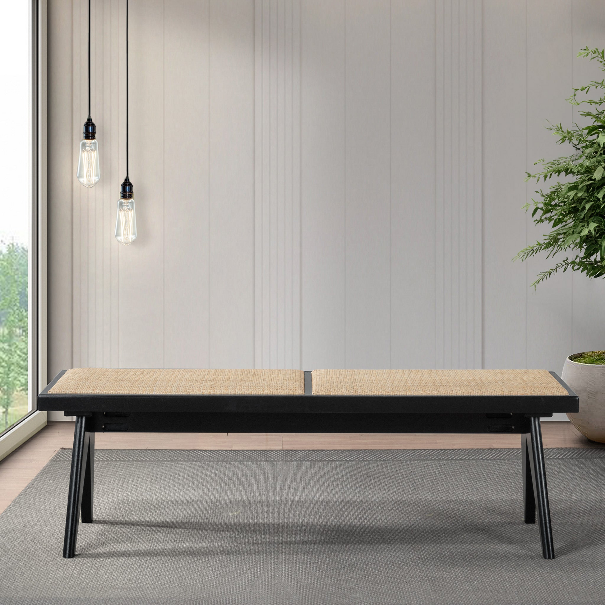 Modern wood bench with woven seat on gray rug in a bright living room, FredCo International furniture