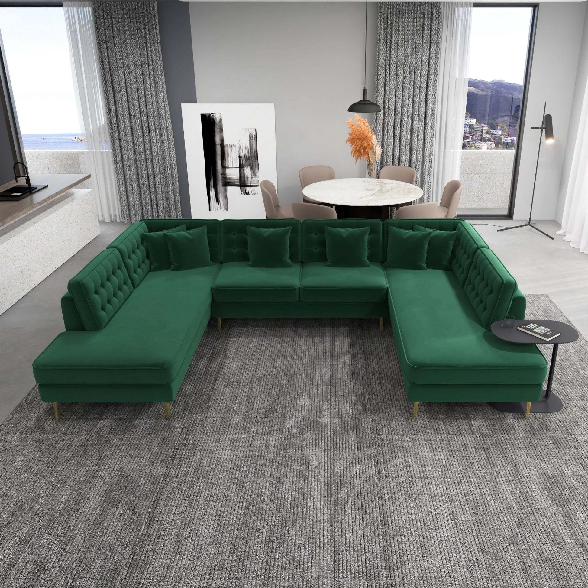 Modern green sectional sofa in a bright living room with dining area, large windows, and gray rug