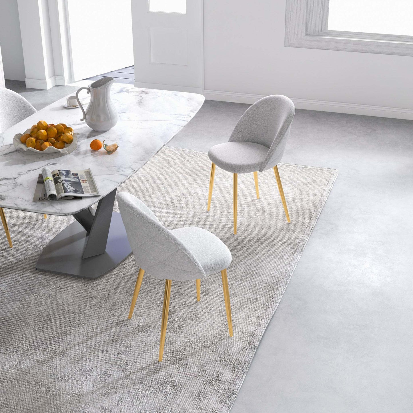 Modern dining room with marble table, white chairs, and fruit bowl, FredCo International furniture