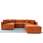 Modern orange sectional sofa with plush cushions on blue patterned rug, FredCo International furniture