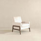 Modern cream armchair with wooden frame in minimalist room, FredCo International furniture