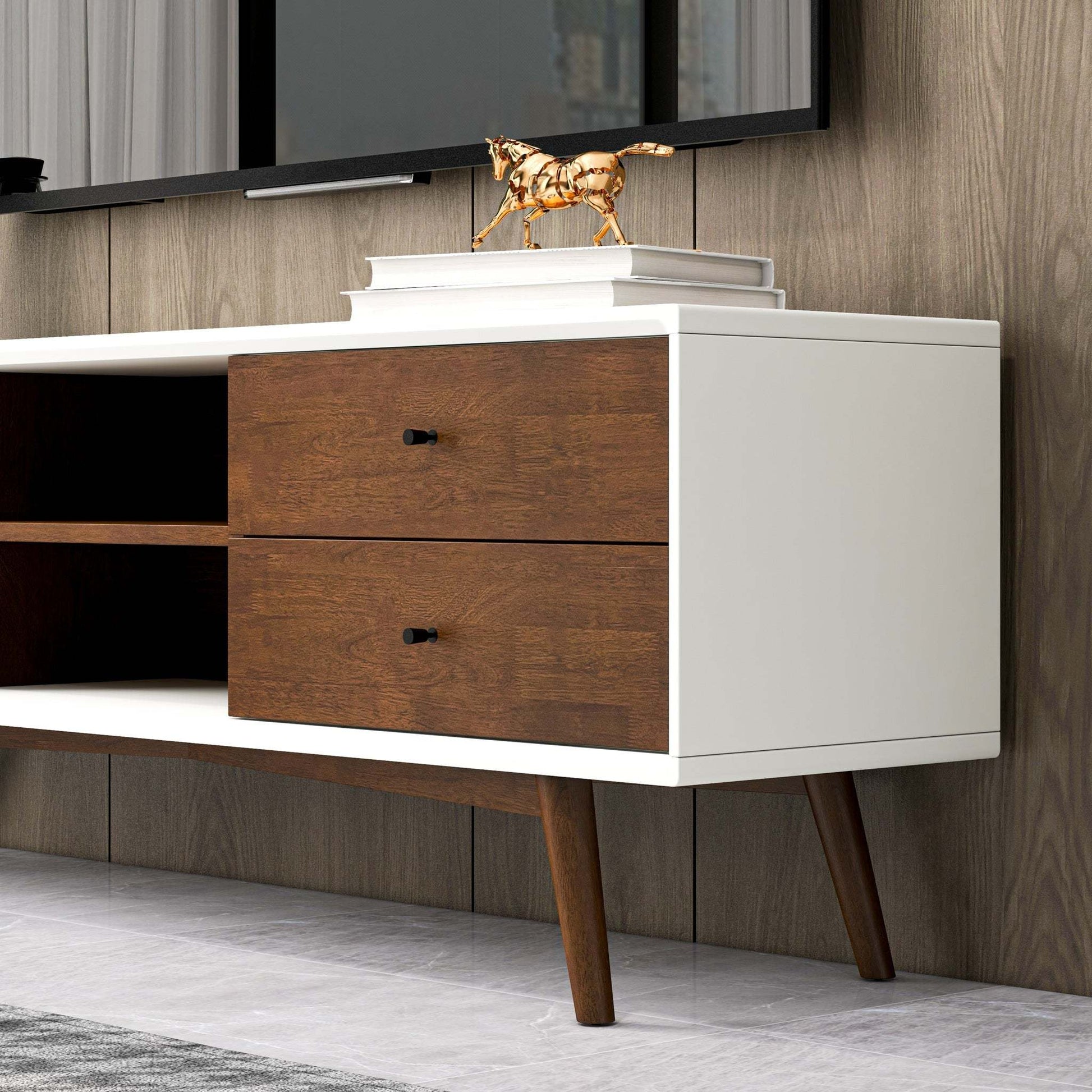 Modern wood and white TV stand with books and gold horse figurine, home furniture décor
