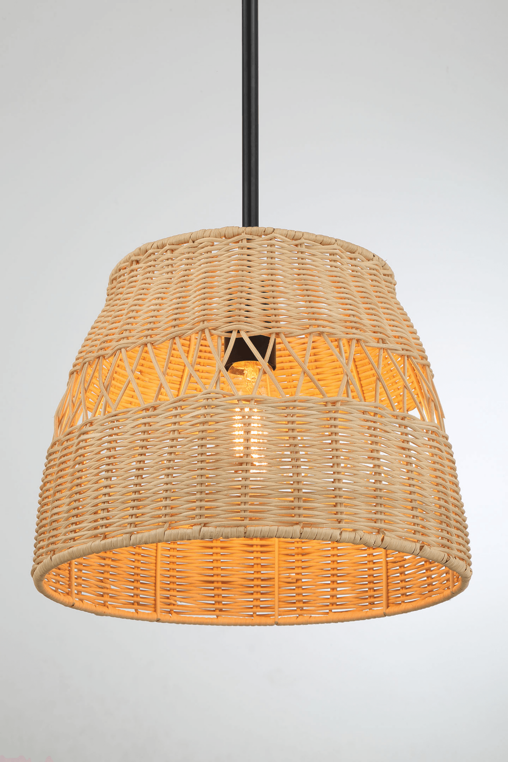 Woven rattan pendant light fixture with warm glow, modern home decor from FredCo International