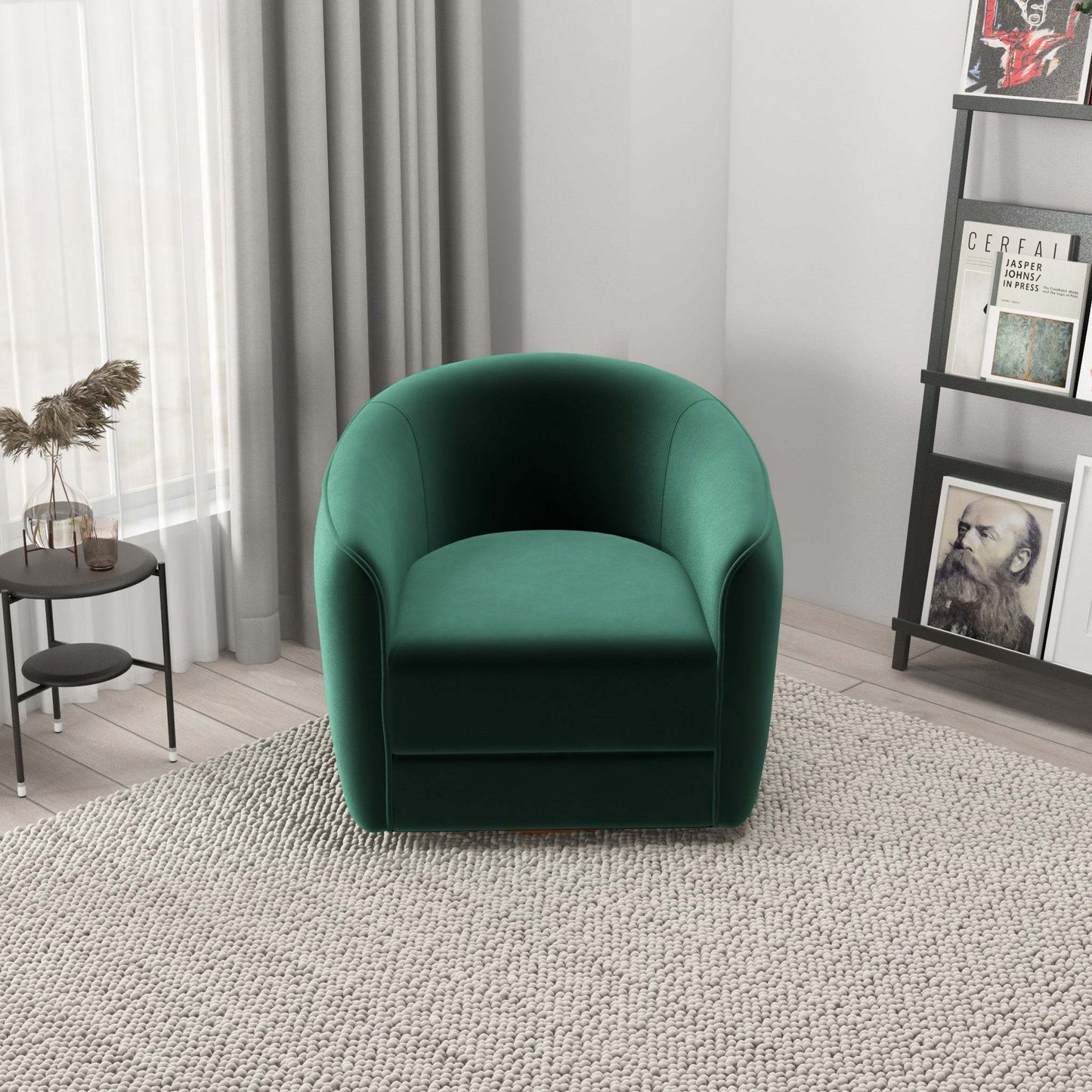 Modern green velvet armchair in living room with neutral decor and bookshelf