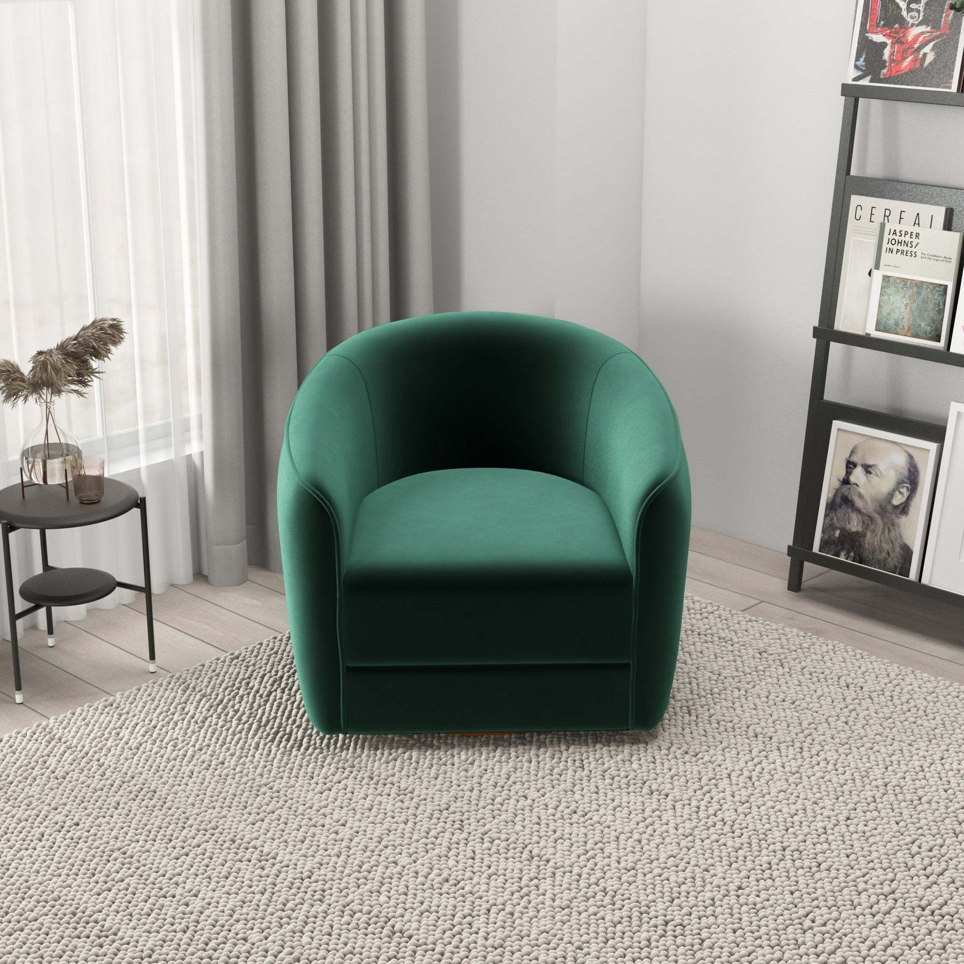 Modern green velvet armchair in living room with neutral decor and bookshelf