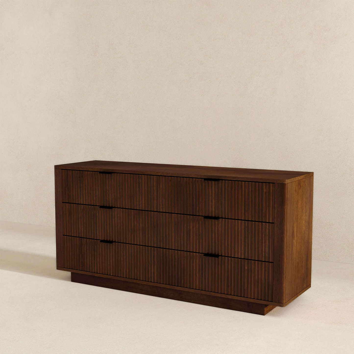 Modern dark wood dresser with three drawers on a neutral background, FredCo International furniture