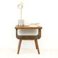 Mid-century modern wooden side table with lamp and books, FredCo International furniture