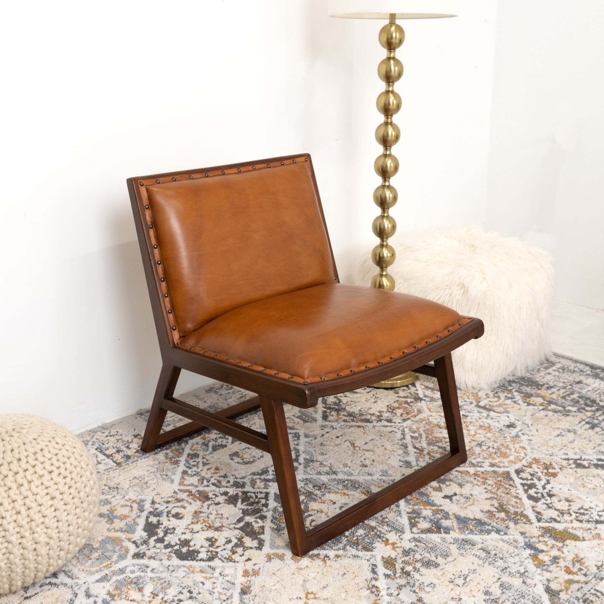 Modern brown leather accent chair with wooden frame in cozy living room setting