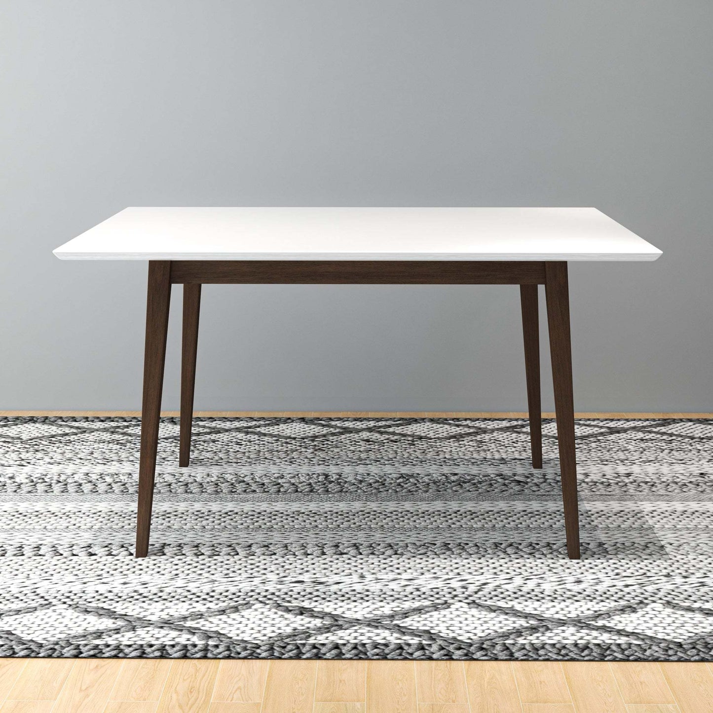 Modern dining table with white top and wooden legs on patterned rug, FredCo International furniture
