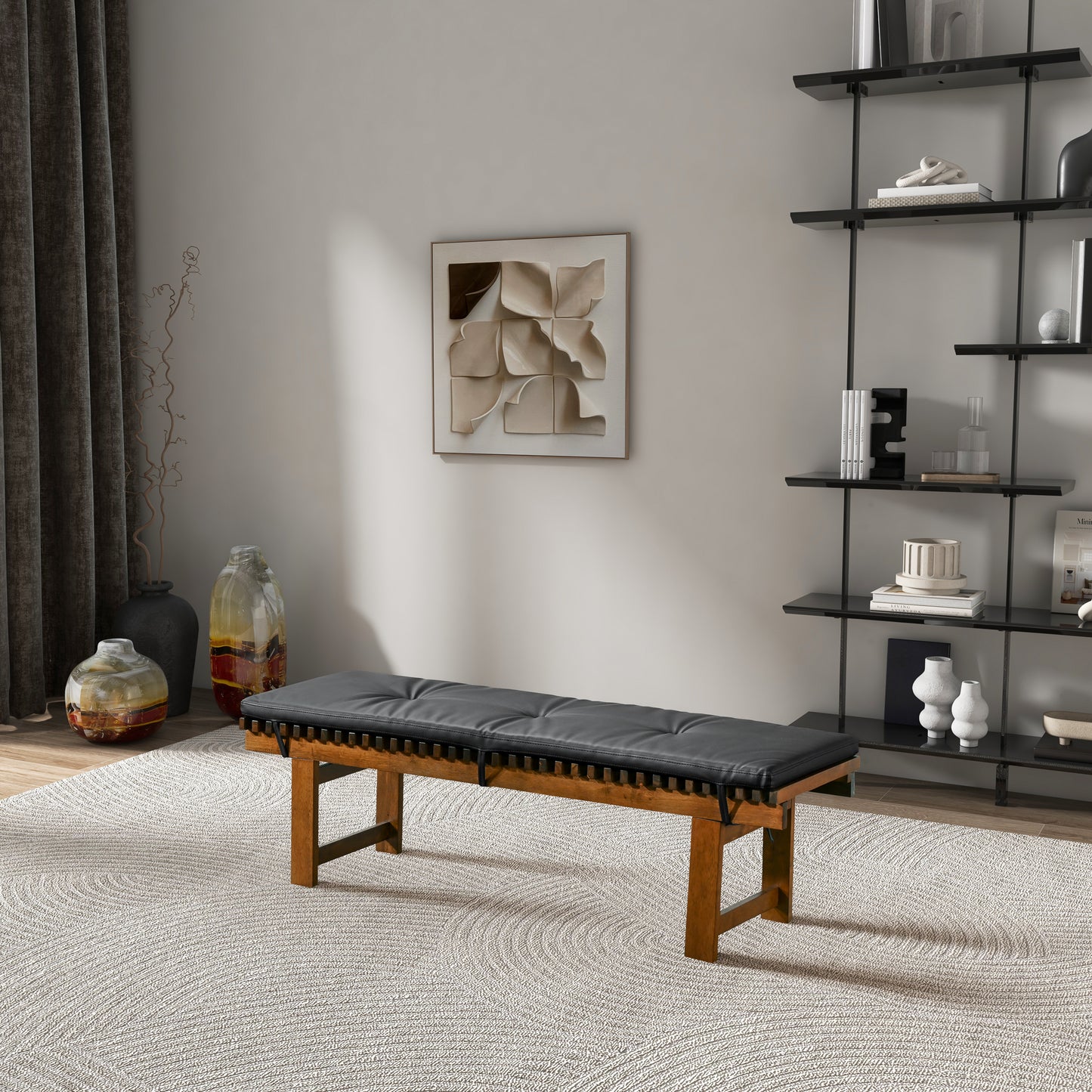 Modern living room with black cushioned wood bench, abstract wall art, and decorative shelves