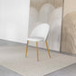 Modern white accent chair with gold legs on beige rug, abstract art background, FredCo International
