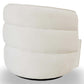 Modern white accent chair with plush, rounded cushions from FredCo International furniture