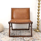 Modern brown leather accent chair with wood frame on patterned rug, FredCo International furniture