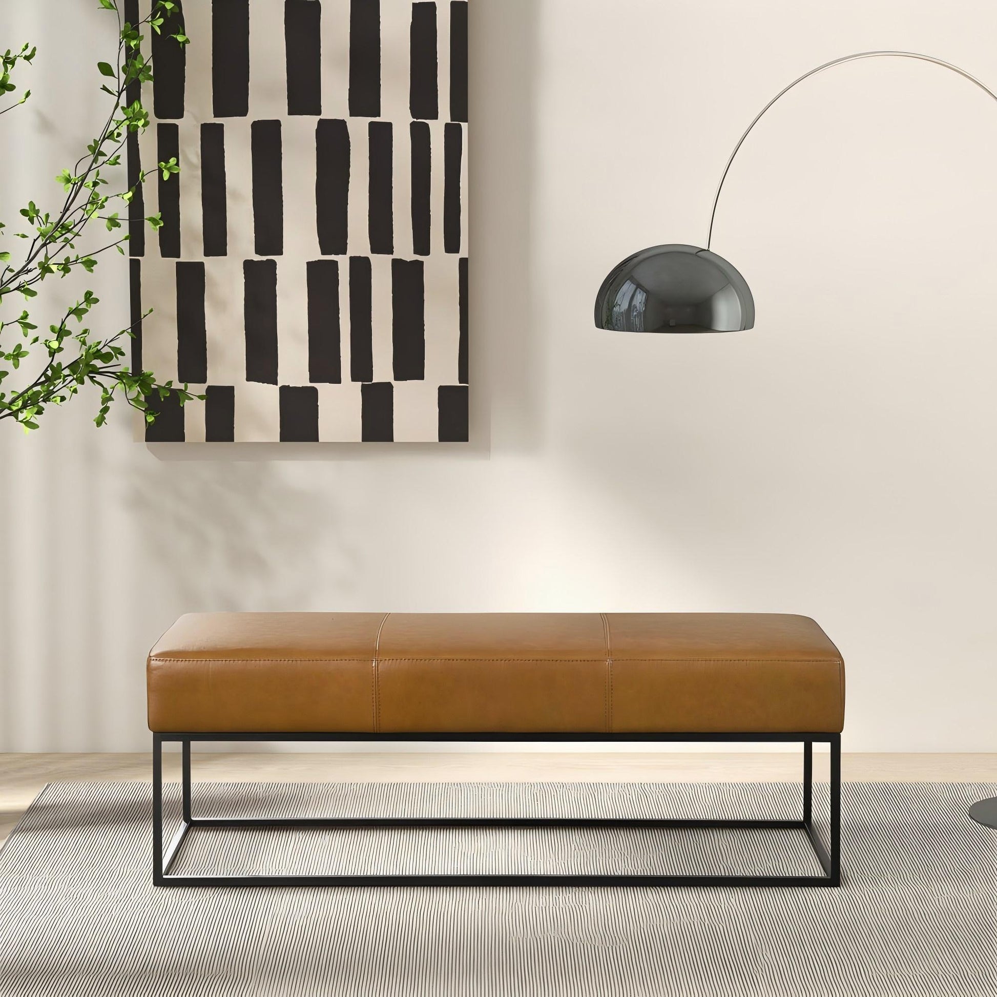 Modern brown leather bench with metal legs in a minimalist living room, FredCo International furniture
