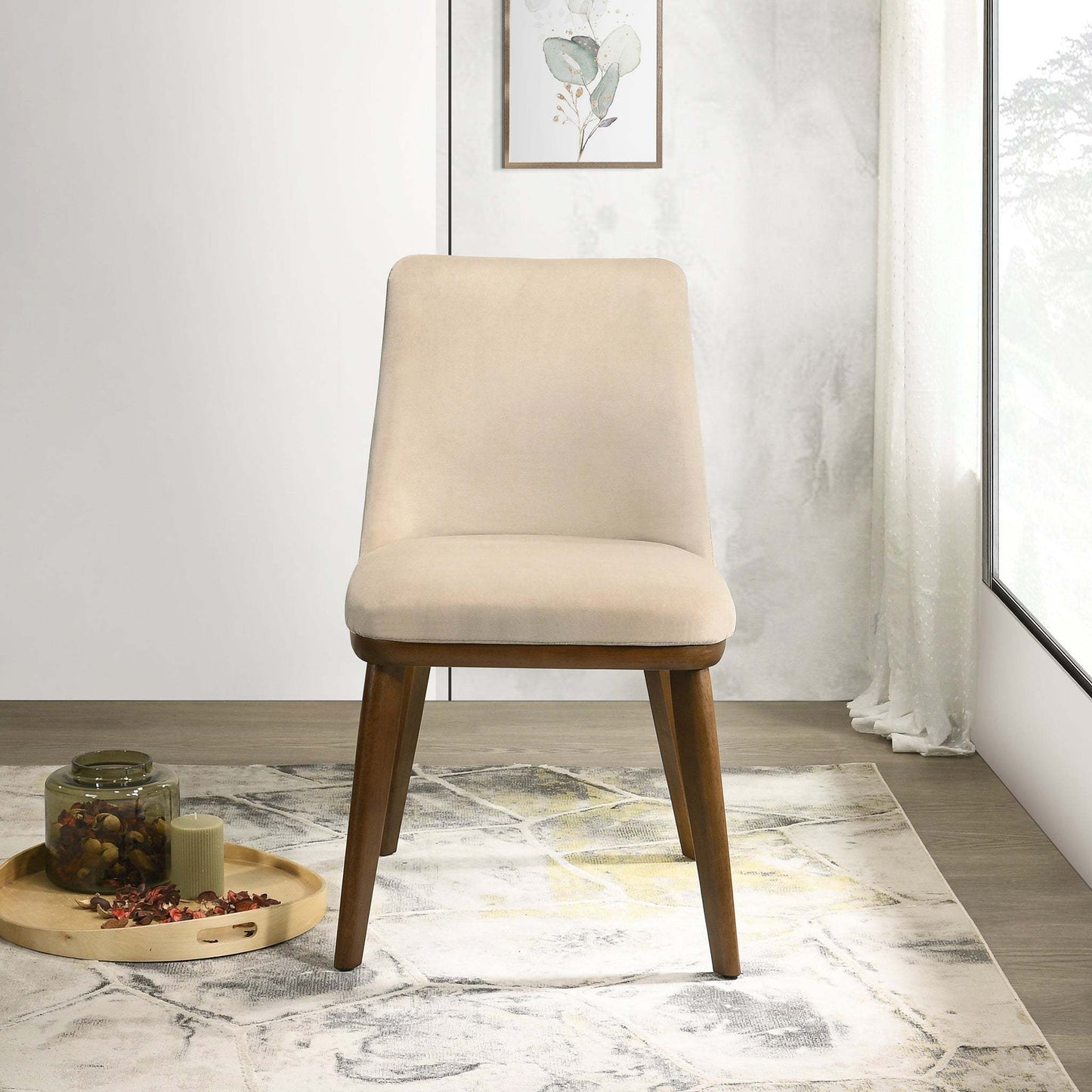 Modern beige upholstered accent chair with wooden legs in bright living room setting