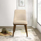 Modern beige upholstered accent chair with wooden legs in bright living room setting