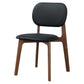 Modern black upholstered dining chair with wooden legs, FredCo International furniture