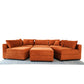 Modern orange sectional sofa with matching ottoman on patterned rug, FredCo International furniture