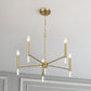 Modern gold chandelier light fixture with six bulbs in a stylish home interior ceiling