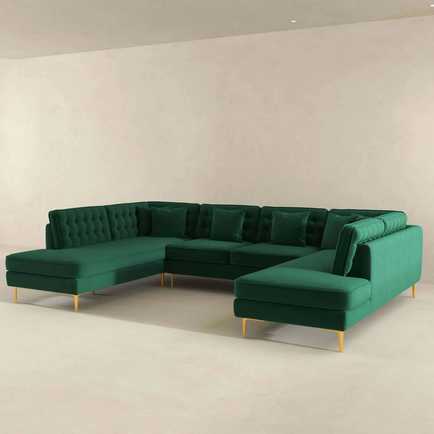 Modern green velvet sectional sofa with tufted back and gold legs in minimal living room
