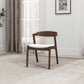Modern wooden dining chair with white cushion in bright living room, FredCo International furniture