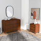 Modern bedroom furniture set with wooden dresser and nightstand in a stylish home interior