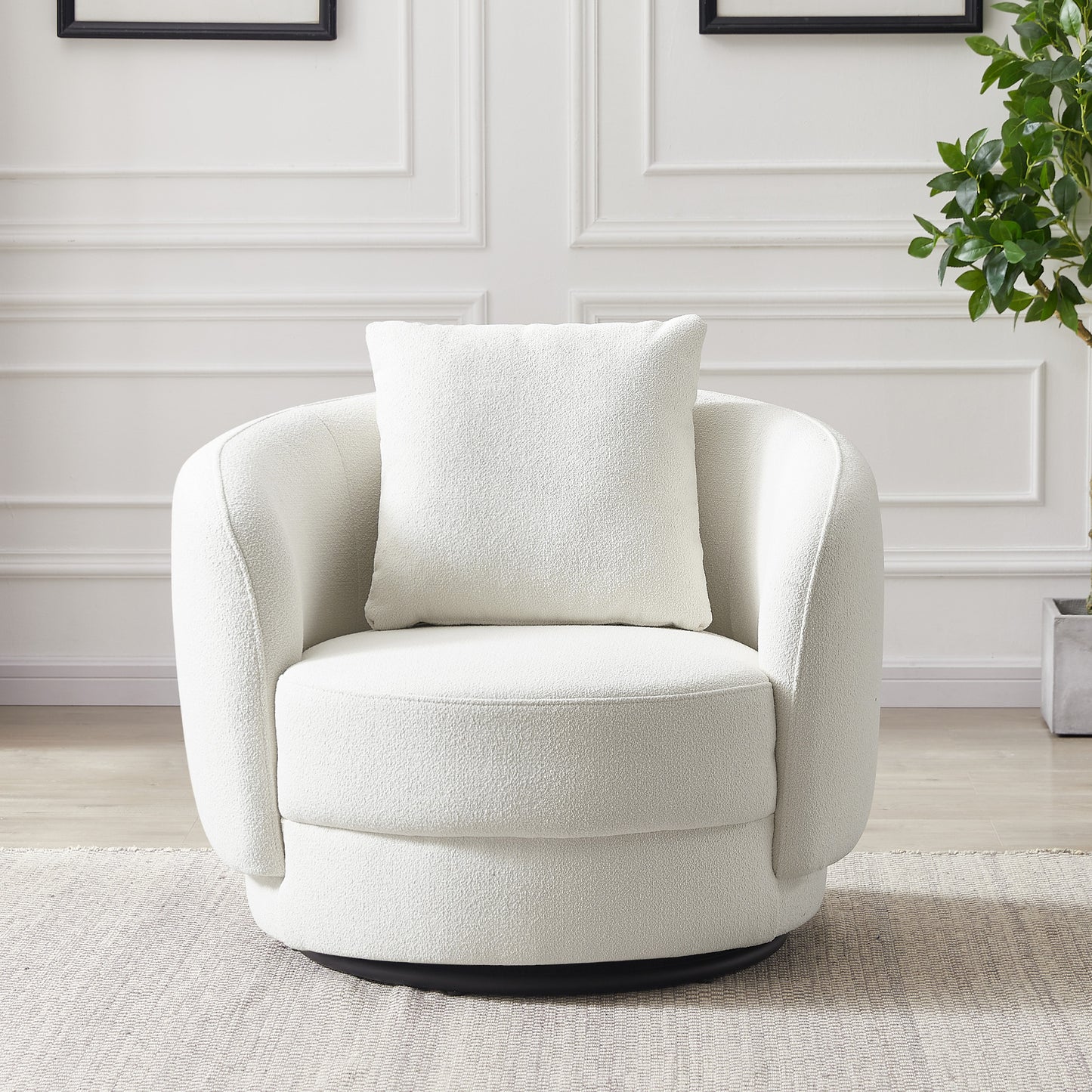 Modern white boucle swivel accent chair with cushion in a bright living room, FredCo International furniture