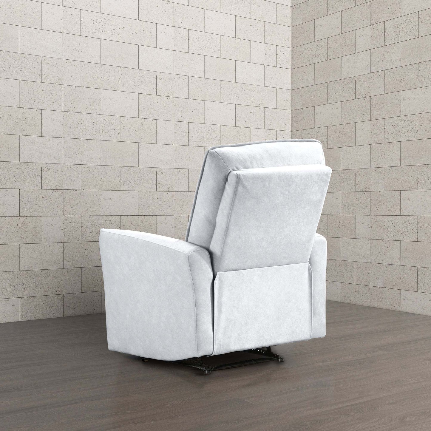 Modern light gray recliner chair in a minimalist room with wood flooring and tiled walls