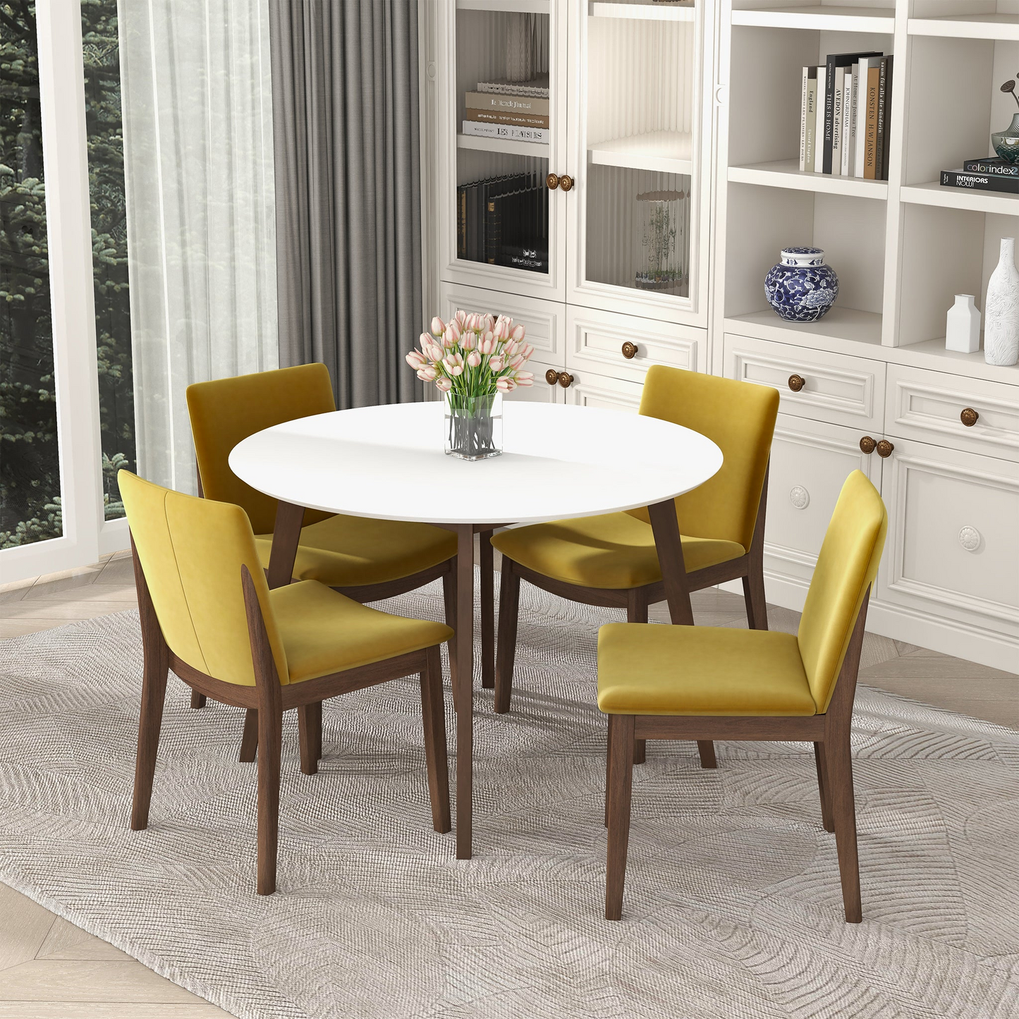 Modern dining room set with round white table, yellow chairs, and floral centerpiece in bright home