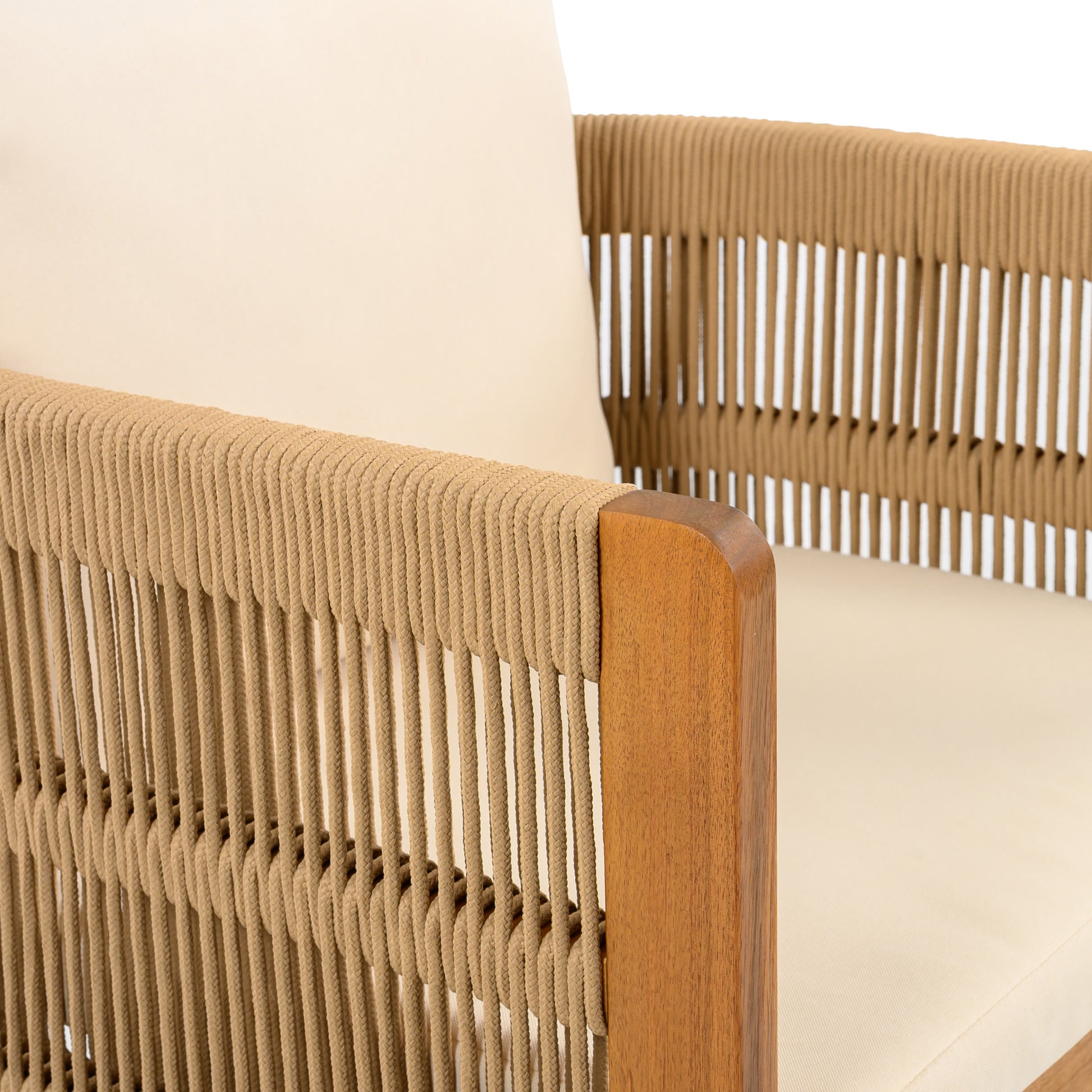 Close-up of modern beige rope and wood accent chair with cream cushion from FredCo International
