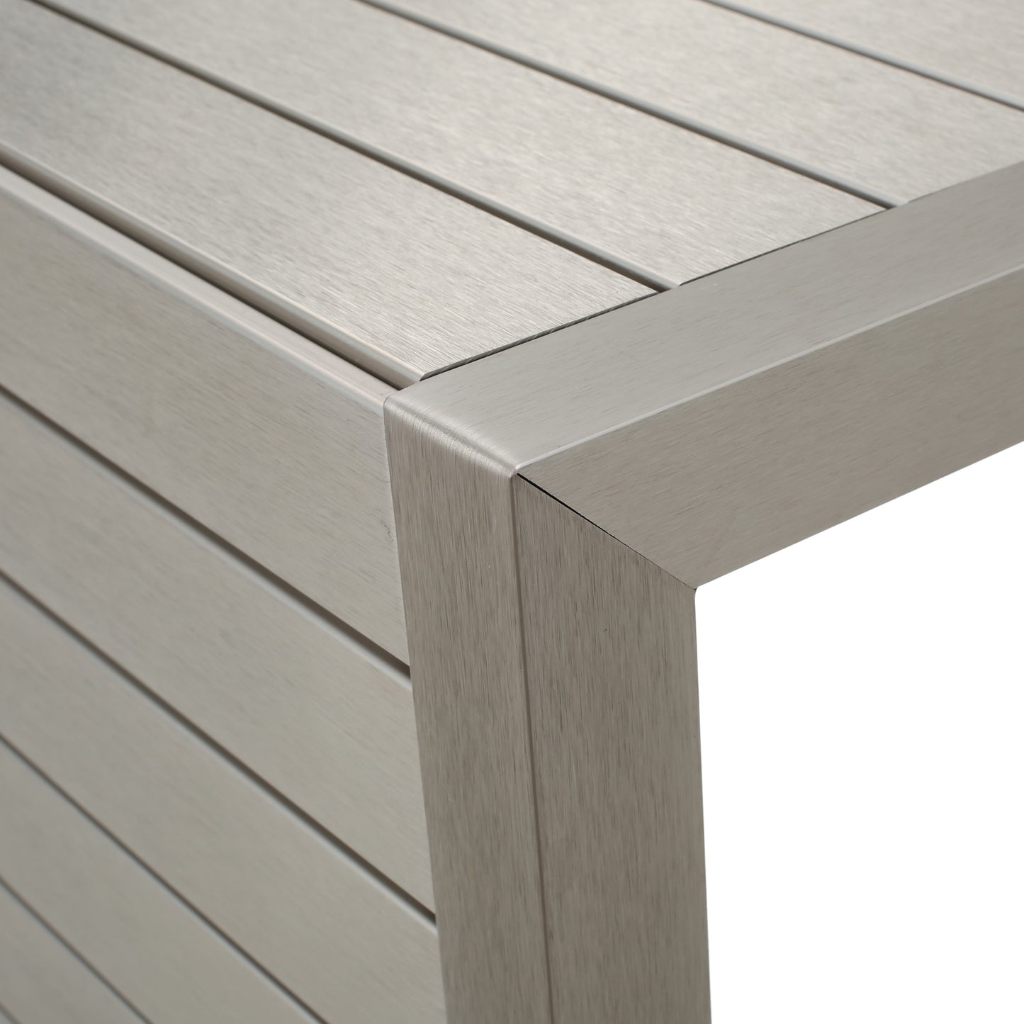 Modern brushed metal table corner with slatted design, FredCo International furniture