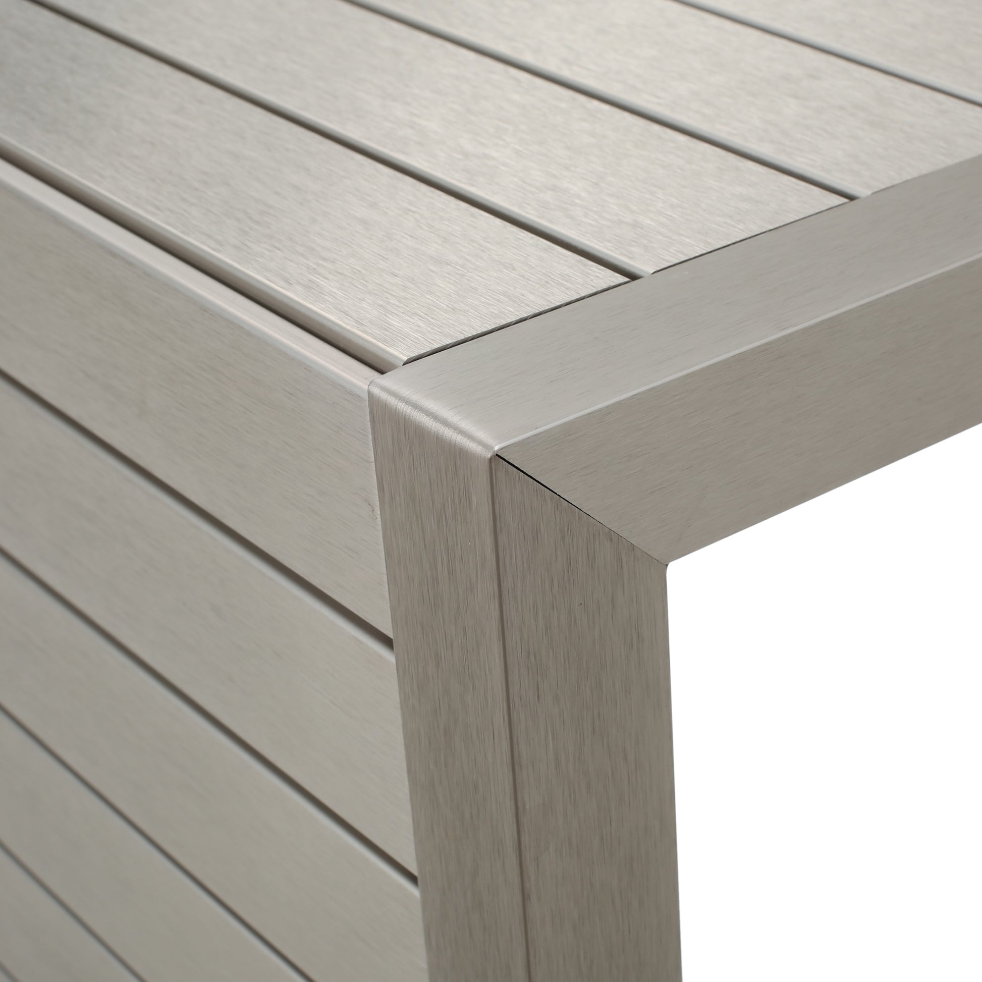 Modern brushed metal table corner with slatted design, FredCo International furniture