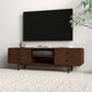 Modern wooden TV stand with drawers under wall-mounted television, vase, and books on top